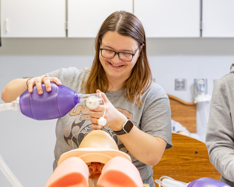 Respiratory Therapy student working in lab.